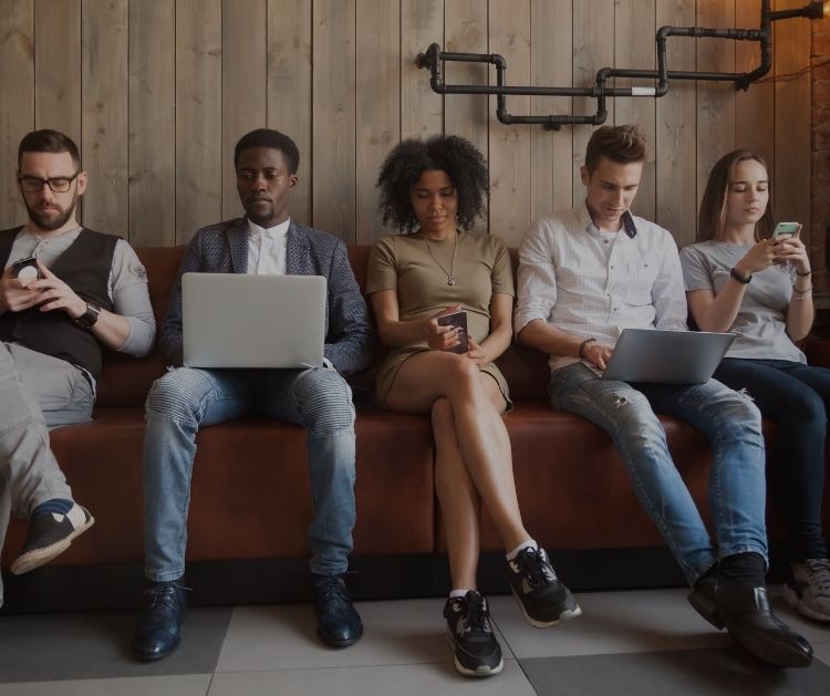 Millennials working with laptops and mobiles